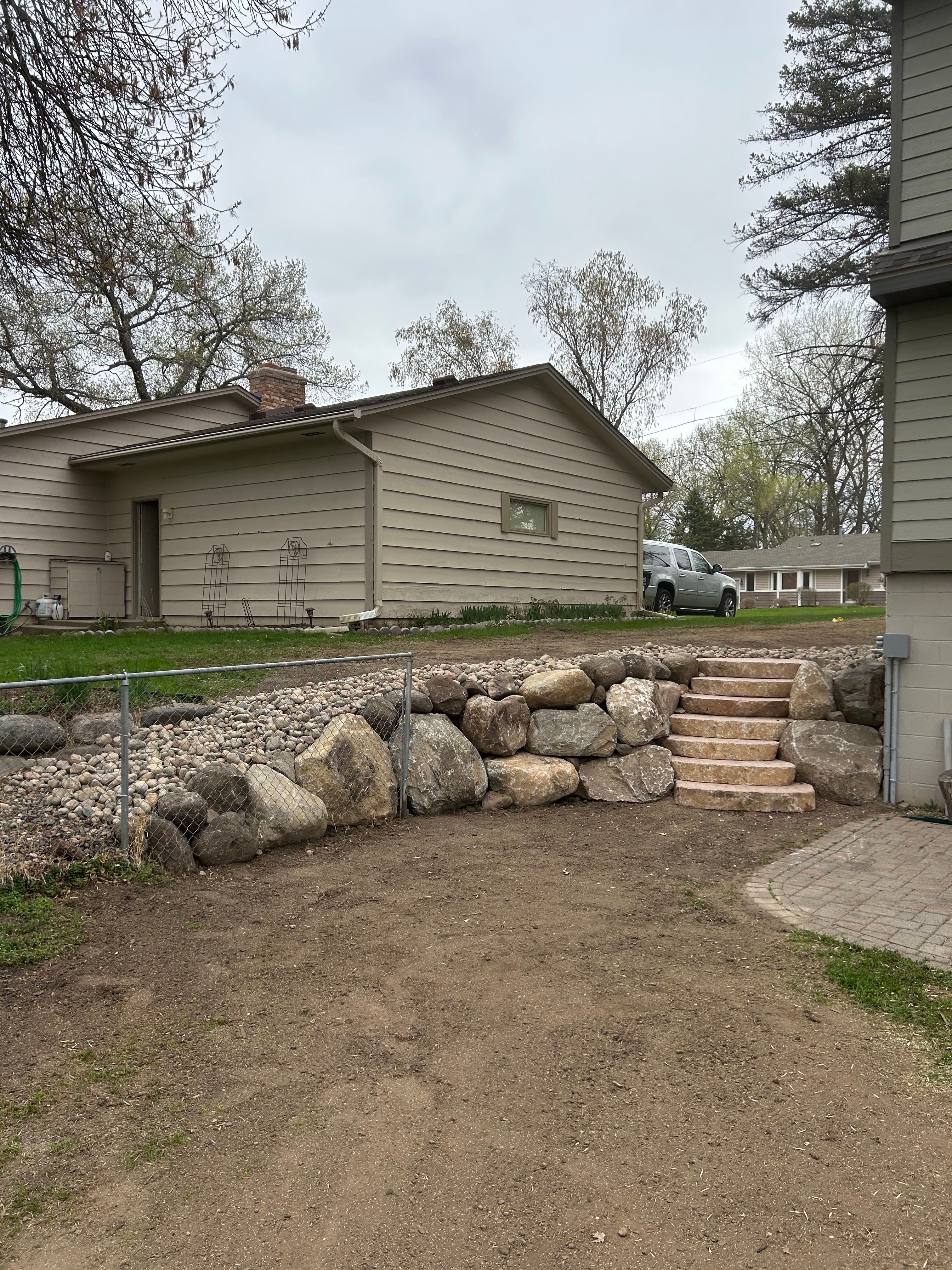 Project Timber Wall Torn Out, Boulder Wall and Fresh Landscaping Put In image
