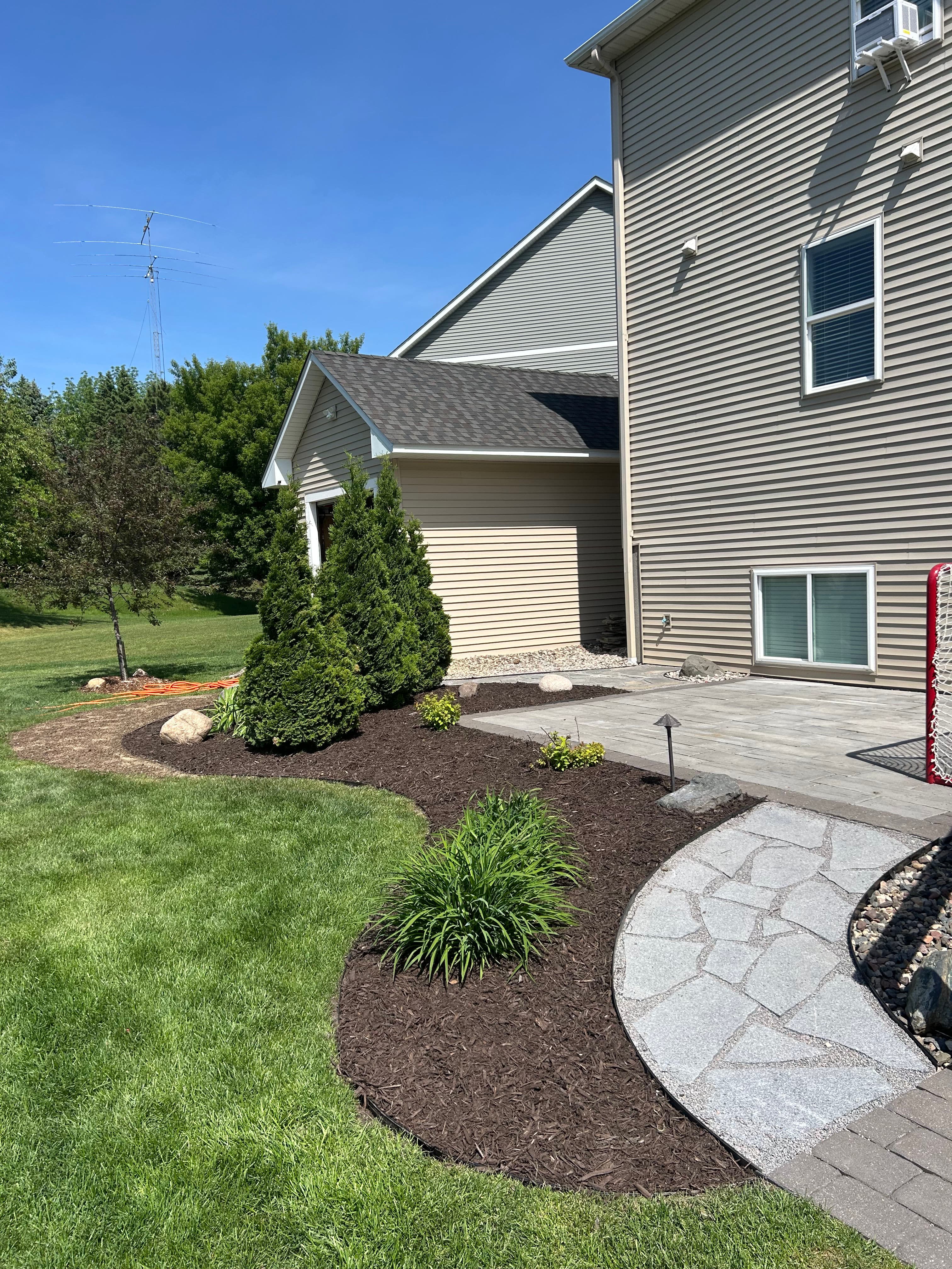 Project Granite Flagstone Walkway and Landscaping Refresh with Dark Mulch image