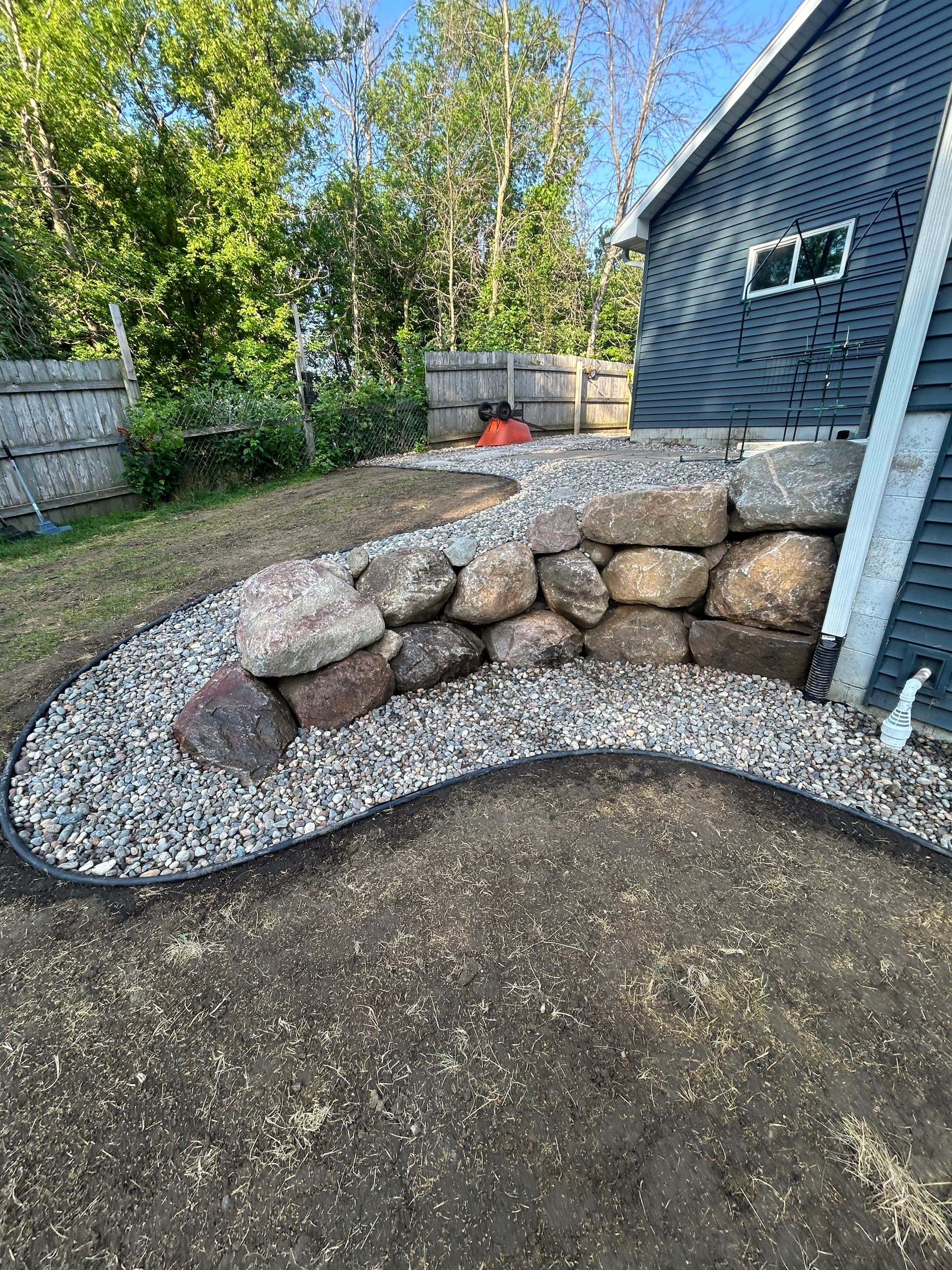 Boulder Wall, River Rock and Backyard Grading Done Right image