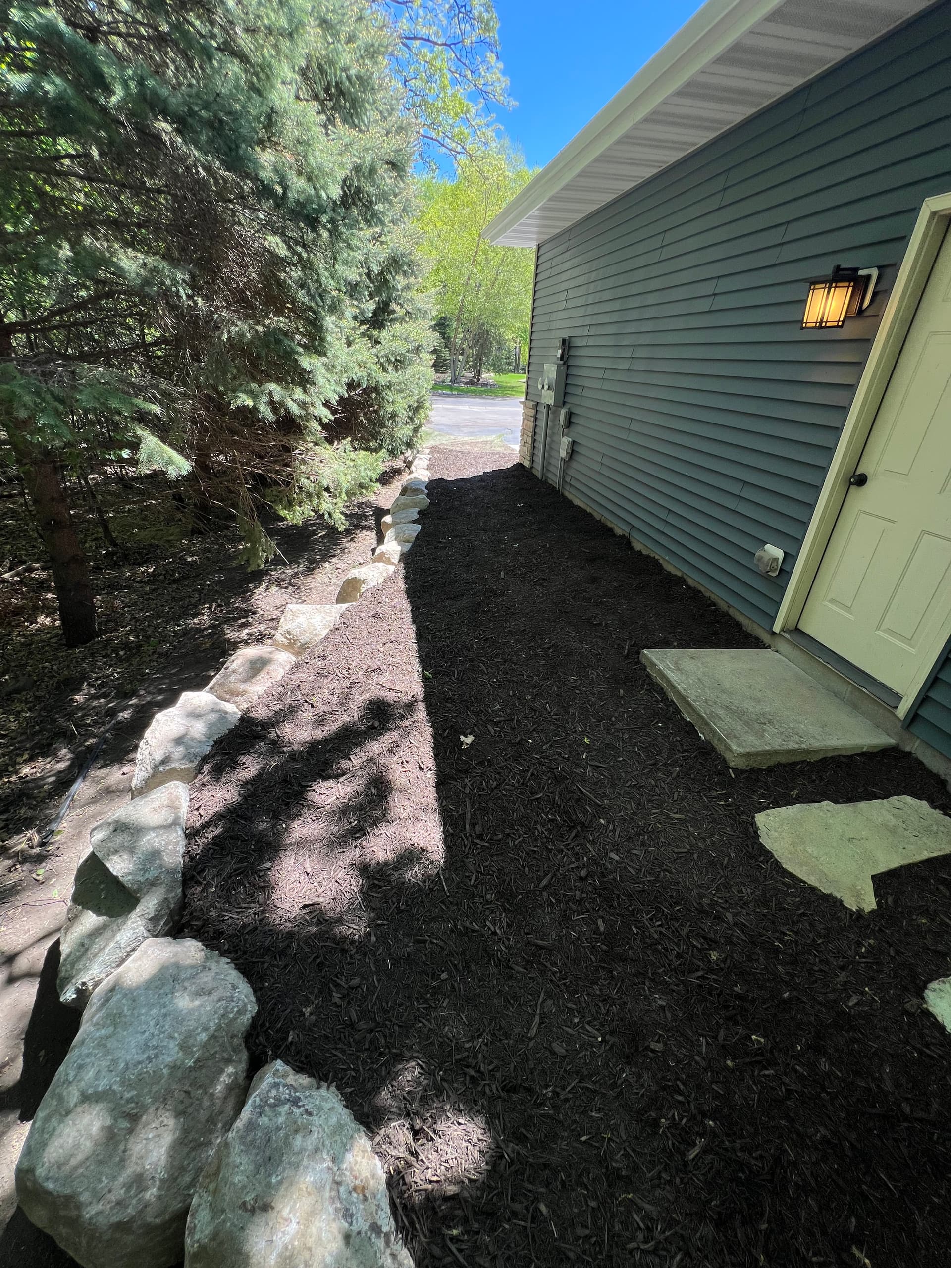 Washed-Out Side Yard Fixed with Boulder Wall and Stone Path image